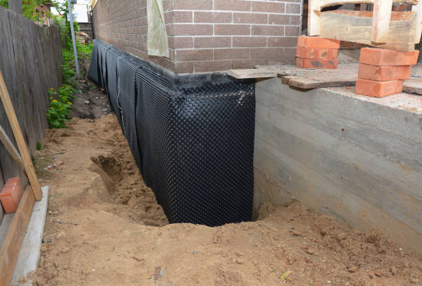 Happy homeowners after waterproofing job in Etlan